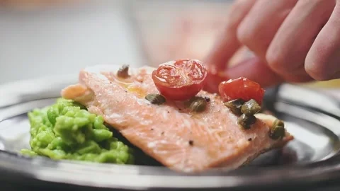 Chef serves baked rainbow trout fillet. Stock Footage 150888945
