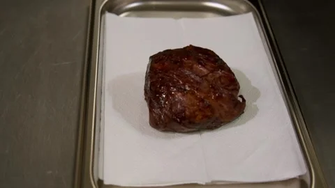 Chef serves beef steak. Slow motion. Video stock 303745071
