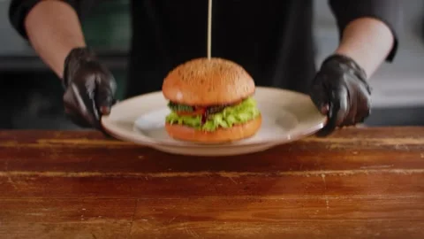 The chef serves a Burger. Close up Stock Footage 131152153