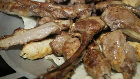 The chef serves a freshly prepared meat dish. Serving meat dishes Video stock 99297064