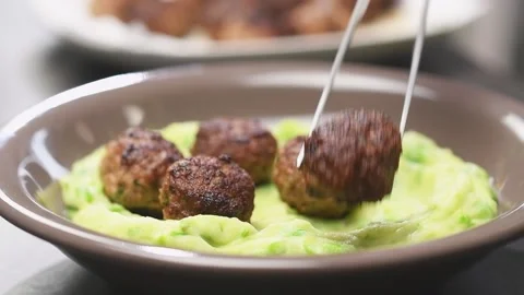 Chef serves fried meatball on puree. Stock Footage 154937495