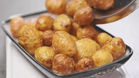 Chef serves fried new potatoes. Stock Footage 153481115