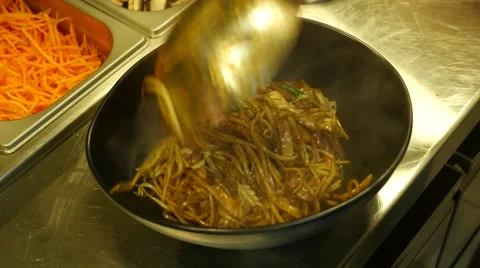 Chef serves noodle dish Stock Footage 40700219