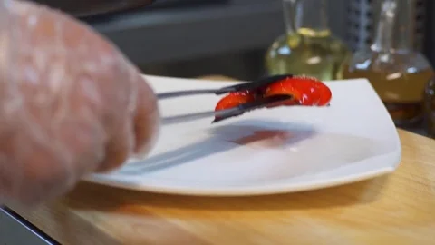 The chef serves a plate of dish Stock Footage 77041751