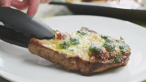 Chef serves pork chop with mozzarella cheese. Stock Footage 165622145