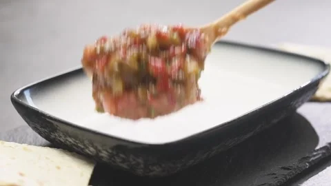 Chef serves roasted eggplant and pepper spread. Stock Footage 159401543