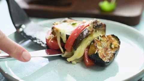 The chef serves the roasted eggplants with tomato and mozzarella cheese. Stock Footage 210718425