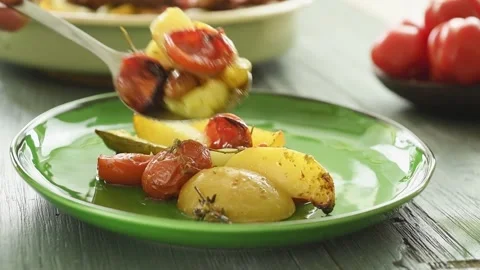 The chef serves the roasted vegetables on the plate. Stock Footage 207022025