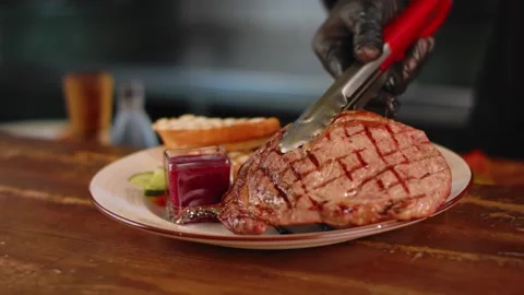 The chef serves the steak. Close up Stock Footage 131152141