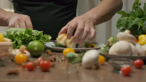 Chef serving chicken roll with spinach on a plate Stock Footage 141263478