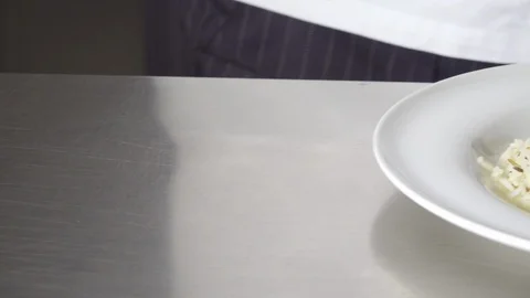 Chef serving chicken with sauce and rice Stock Footage 127854909