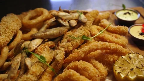 Chef serving deep fried fish mix food set composition with microgreens. Cook 스톡 동영상 158916688