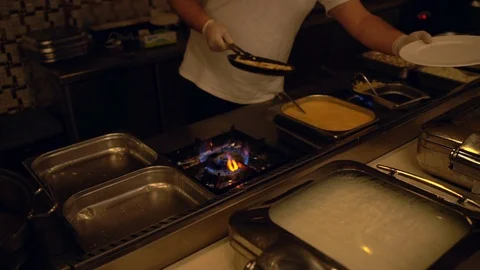 Chef serving in egg omelette onto a plate Stock Footage 108113535
