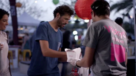 Chef serving food to customer at park. Stock Footage 63638727