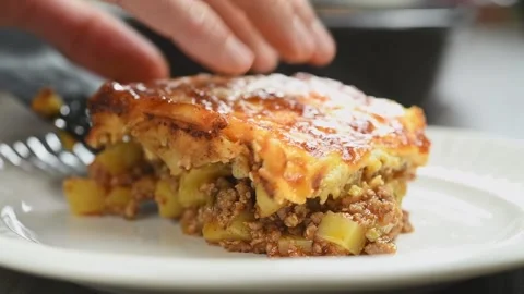 The chef serving fresh cooked moussaka. Stock Footage 171936664
