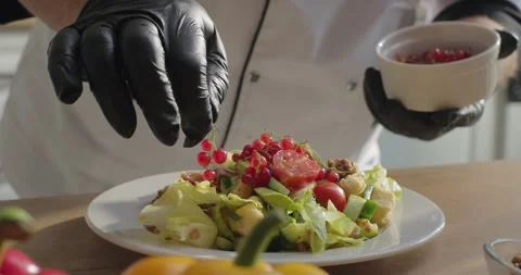 Chef serving healthy vegetable salad plate with red currant. Dish serving Stock Footage 277766514