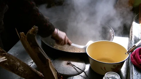 Chef serving noodle soup into bucket in kitchen Stock Footage 88333133