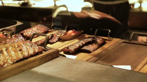 Chef Serving ribs in a meat restaurant Stock Footage 94368839