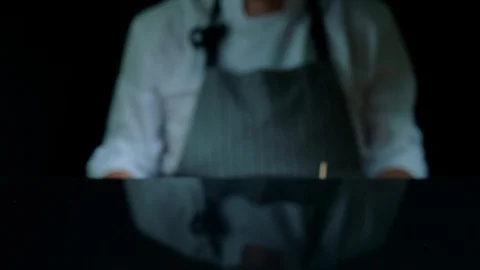 Chef is serving set of tasty burger, french fries, beer on the wooden tray on Stock Footage 92494523