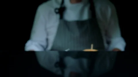 Chef is serving set of tasty burger, french fries, beer on the wooden tray on Stock Footage 92496294