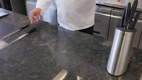 Chef setting out a selection of kitchen knifes 스톡 동영상 231773086