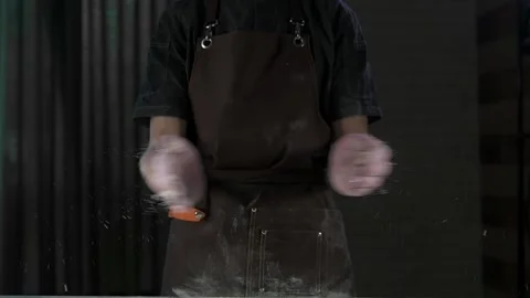 Chef shakes flour off his hands Stock-Footage 134955035