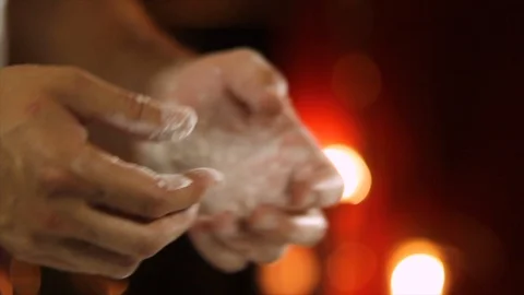 Chef shaking his hands to extract the flour Close Up Stock Footage 94903526