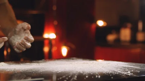 Chef shaking his hands to extract the flour Stock Footage 100634567
