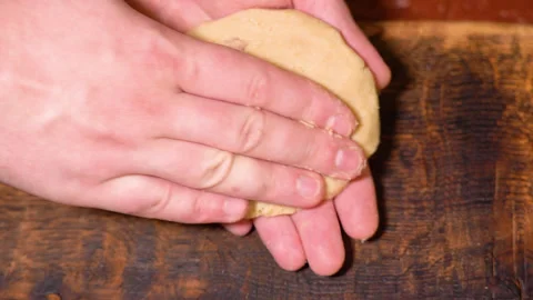 A chef is shaping the dough to make dumplings. Stock Footage 252603224