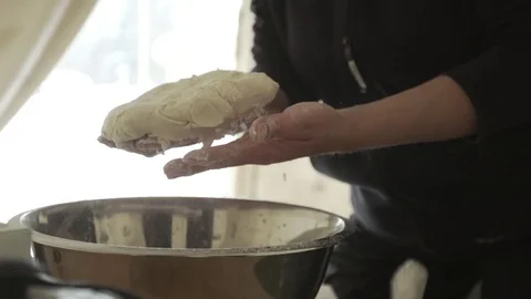 Chef shaping a soft dough in kitchen Stock Footage 79791530
