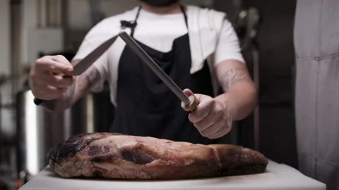Chef sharpening his knife. Stock Footage 134500918