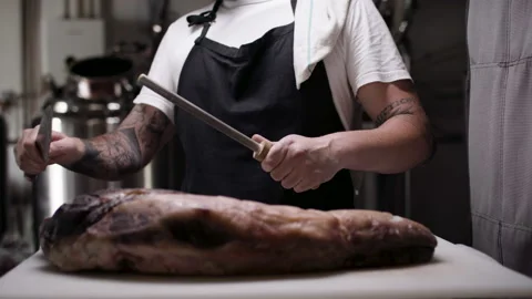 Chef sharpening his knife. Stock Footage 134500930