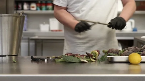 Chef sharpening a kitchen knife Stockbeeldmateriaal 92058874