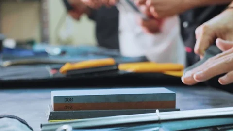 Chef sharpening a knife, close-up Stock Footage 92411551