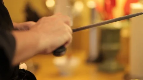 Chef sharpening a knife Stock Footage 117541295