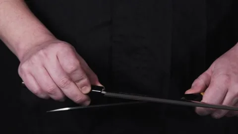 Chef sharpening knife. Stock Footage 140489009