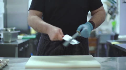 Chef sharpens kitchen knife Stock Footage 63445687