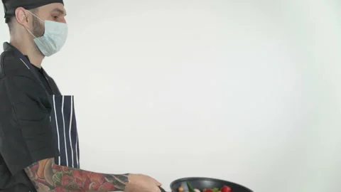 Chef show pan technics how to flip food in pan Stock Footage 143635280