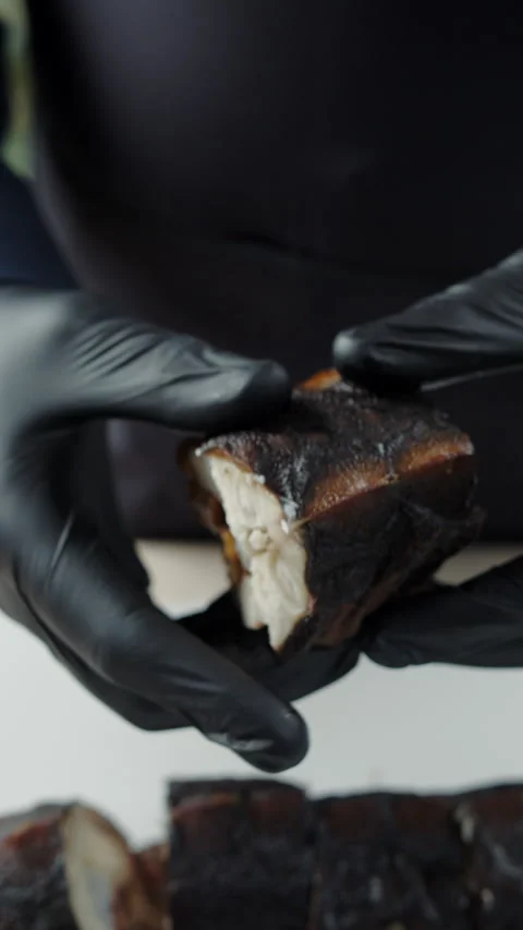 Chef showing cross section of smoked sturgeon fish Stock Footage 307861791