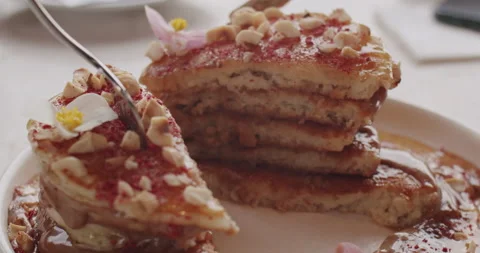 The chef shows a cut of pancake dessert with chocolate raspberries and nuts 스톡 동영상 151835409