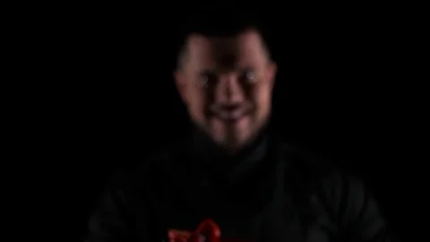 Chef shows dessert on a black background Stock Footage 69920848