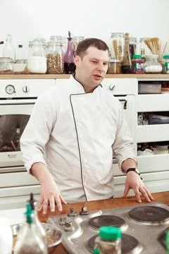 The chef shows a master class in the kitchen, shows the students a cooking Stock Photos