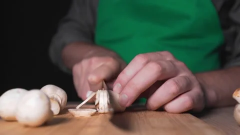 Chef shreds champignones for vegetable salad Video stock 143779514