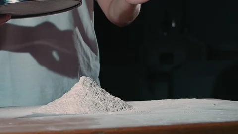Chef sifts flour Stock Footage 92578931