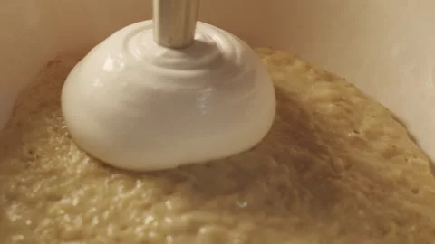 The chef siphons white mousse on top of the cooked oatmeal porridge Stock-Footage 154148681