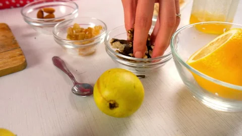Chef skillfully chopping walnuts on rustic wooden board cooking dessert. 스톡 동영상 312998326