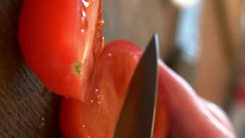 Chef skillfully slices tomato, culinary art. technique tomato slicing, cooking Stock Footage 258671383