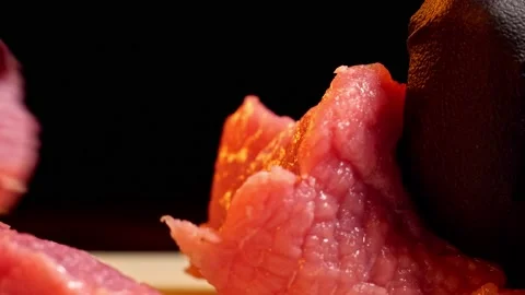 Chef slice a piece of raw beef. Close-up shot of meat slicing Stock Footage 148053174