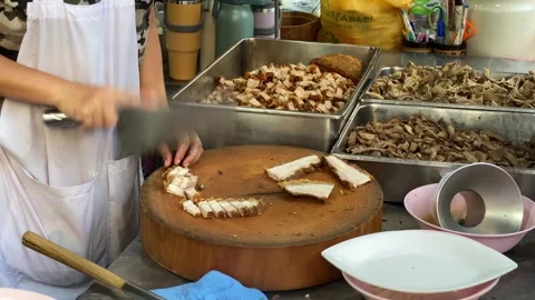 Chef slice roasted pork belly in Chinatown, Bangkok, Thailand 4K Stock Footage 266538256