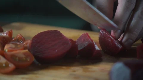 Chef slices beet on a cutting board in a restaurant. Prepare food. Stock-Footage 124755050